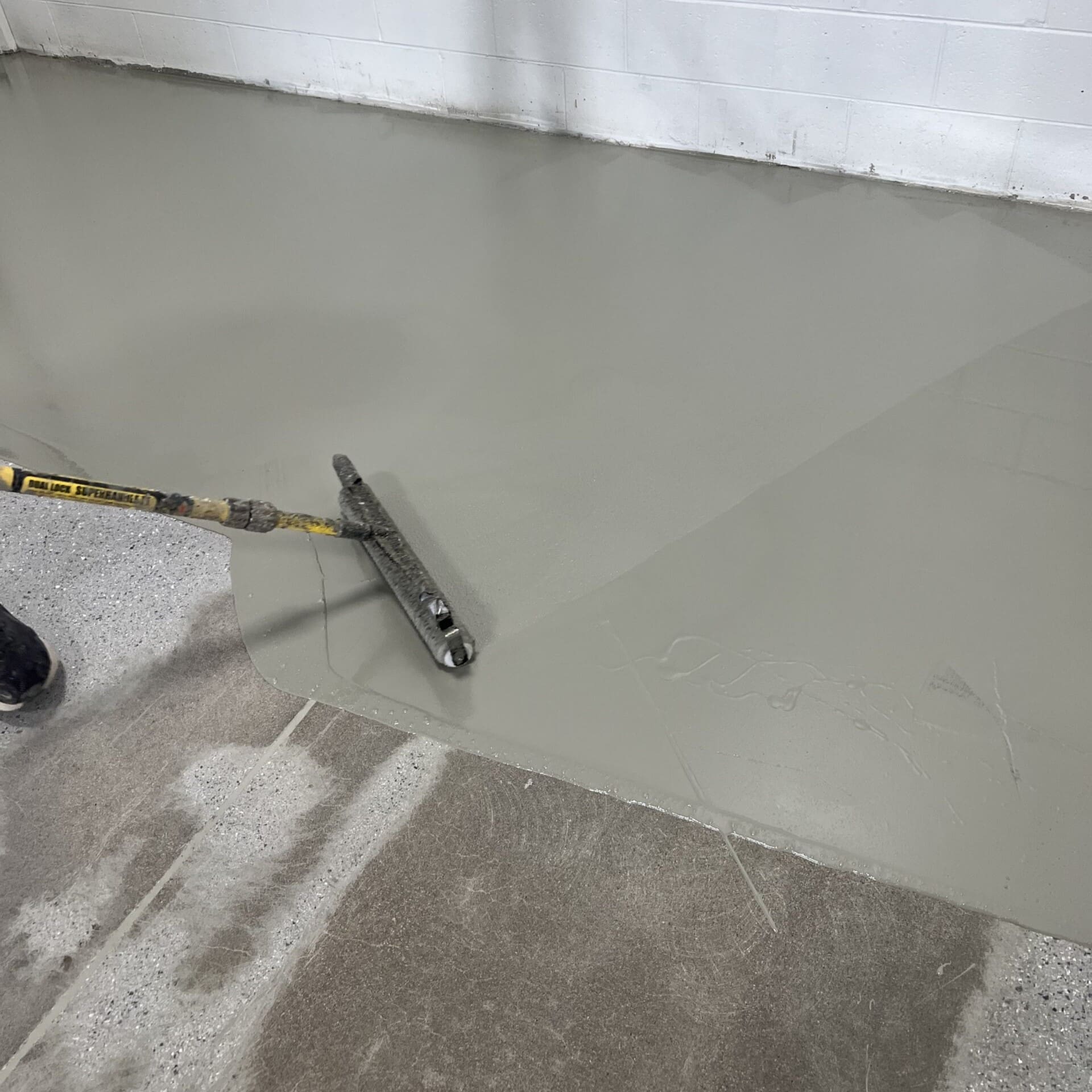 Installing concrete floor coating