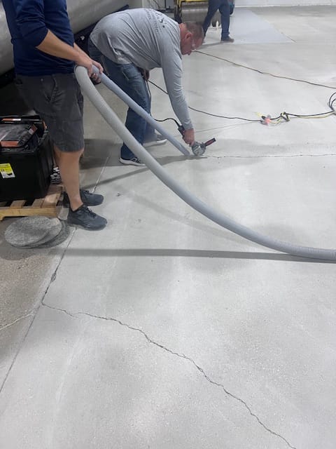 Repair of cracked concrete using a crack chaser
